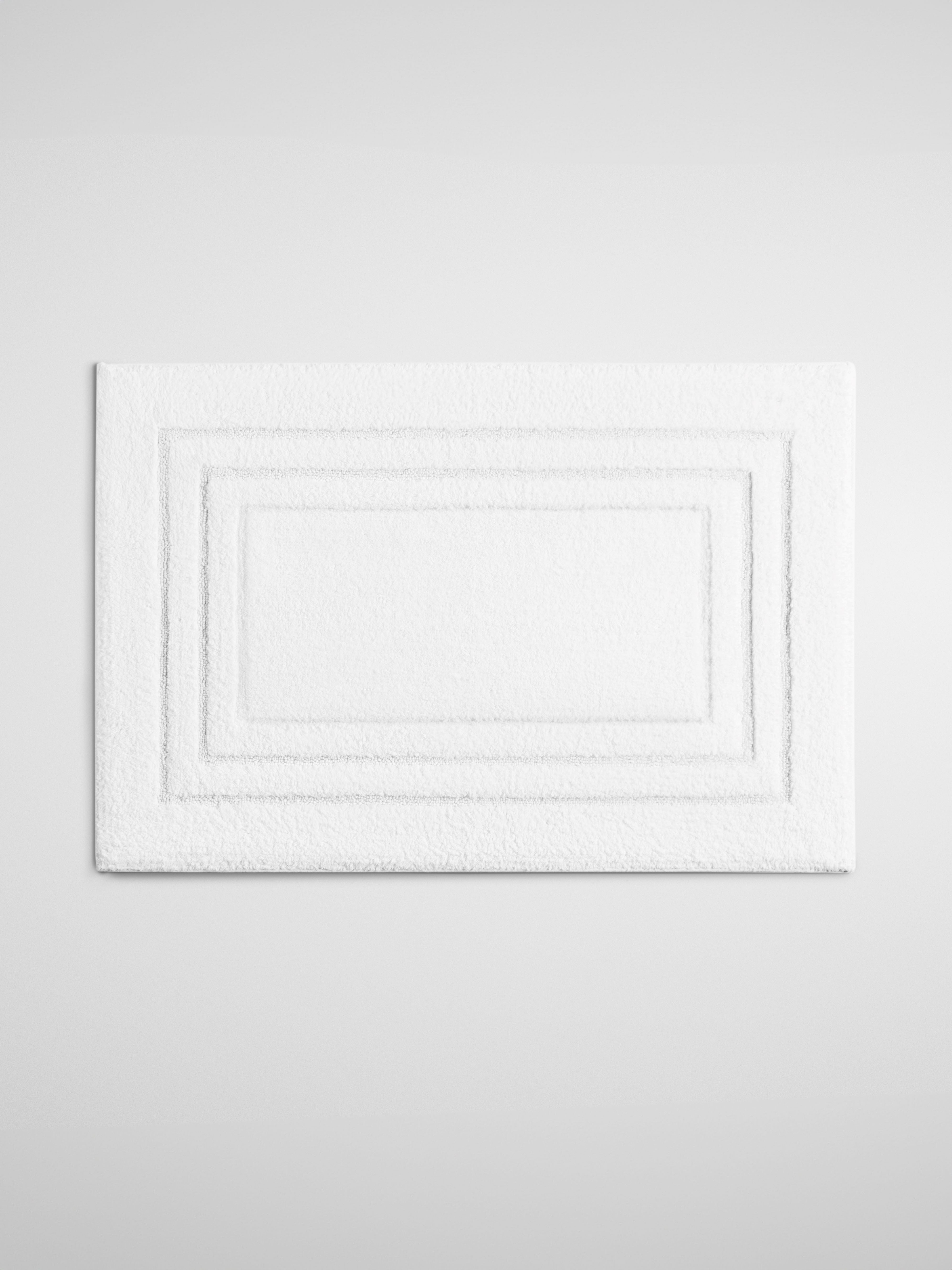 Four Seasons Plush Bath Mat, soft white mat with triple frame design, cozy and luxurious bathroom addition